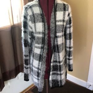 Leather trimmed black and white sweater